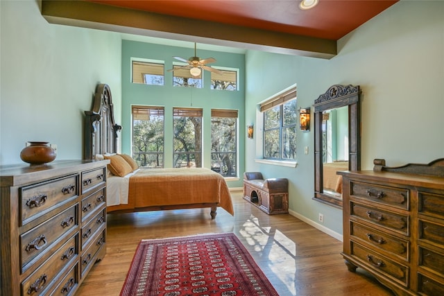 bedroom with ceiling fan and light wood-type flooring