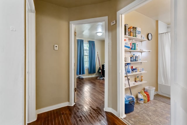 hallway featuring hardwood / wood-style flooring