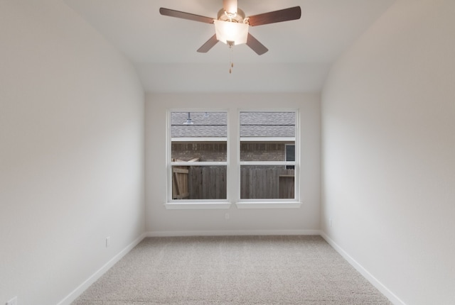 unfurnished room featuring lofted ceiling, light colored carpet, and ceiling fan