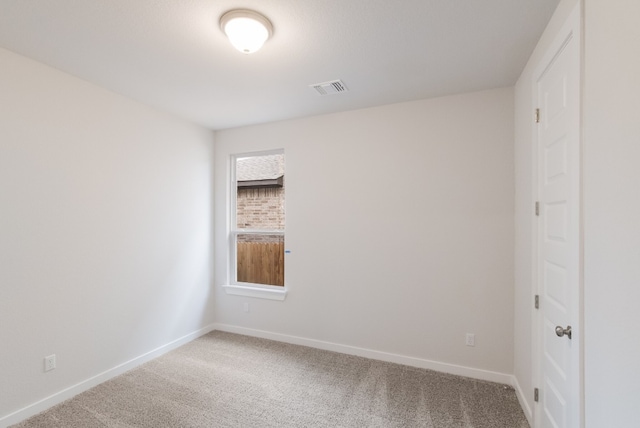 unfurnished room with light colored carpet