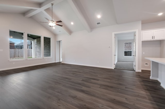 unfurnished living room with ceiling fan, high vaulted ceiling, dark wood-type flooring, and beamed ceiling