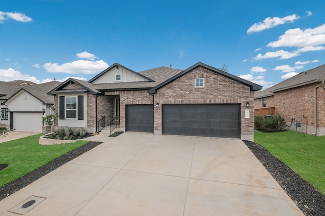 view of front of home featuring a front yard and a garage