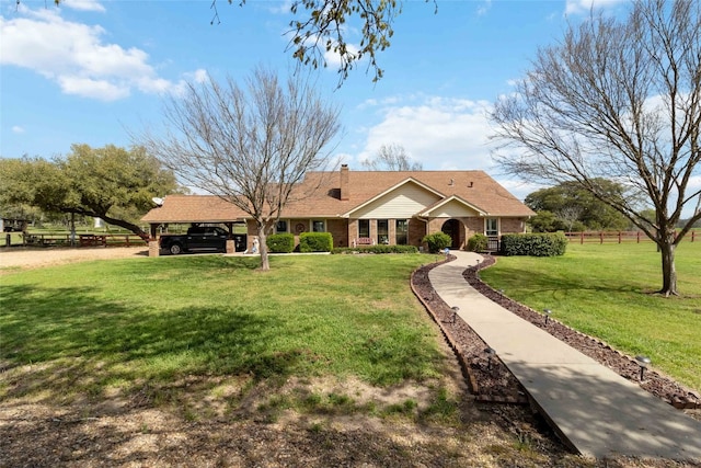 ranch-style house featuring a front lawn