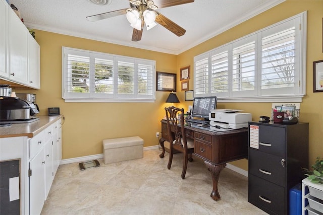 office featuring crown molding, baseboards, and a ceiling fan