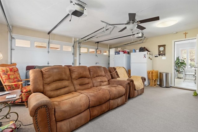 living area with ceiling fan, carpet flooring, and a garage