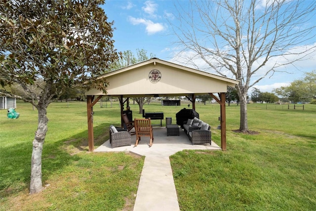 view of home's community featuring a gazebo, outdoor lounge area, a yard, and a patio