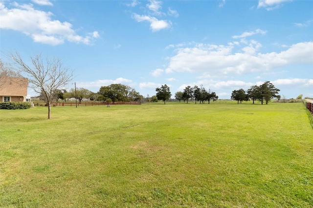 view of yard with a rural view