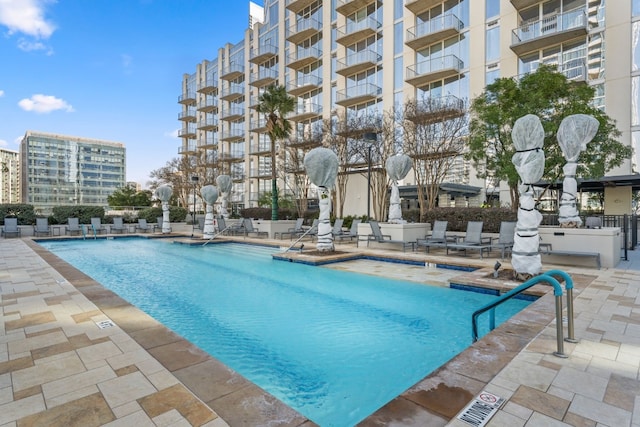 view of pool featuring a patio