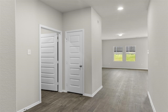 corridor featuring dark hardwood / wood-style flooring