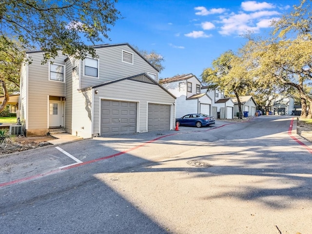 view of property exterior featuring a garage