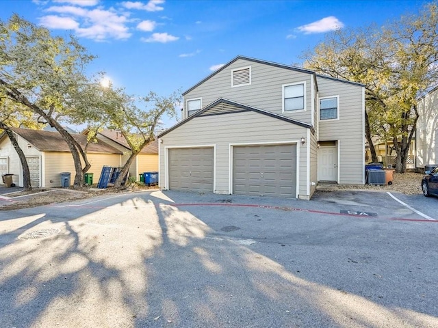 7825 Beauregard Cir Unit 5, Austin, TX 78745 - view of front facade featuring a garage