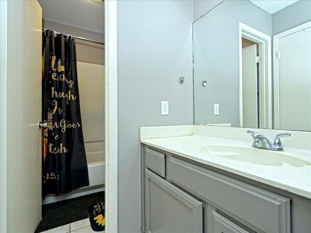 7825 Beauregard Cir Unit 5, Austin, TX 78745 - bathroom featuring vanity, shower / bathtub combination with curtain, tile patterned floors, and a textured wall