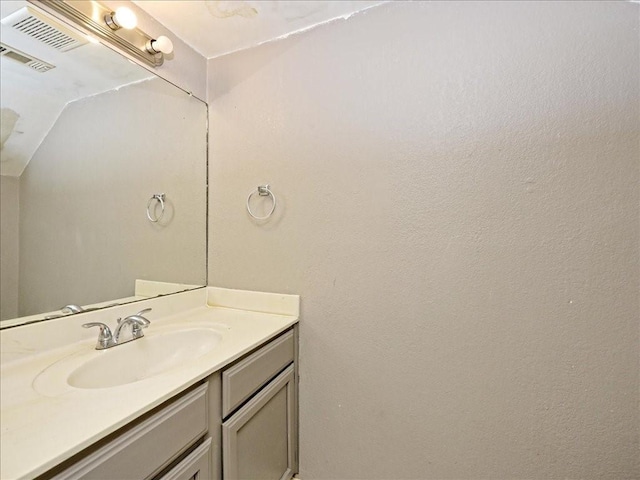 7825 Beauregard Cir Unit 5, Austin, TX 78745 - bathroom featuring vanity and lofted ceiling