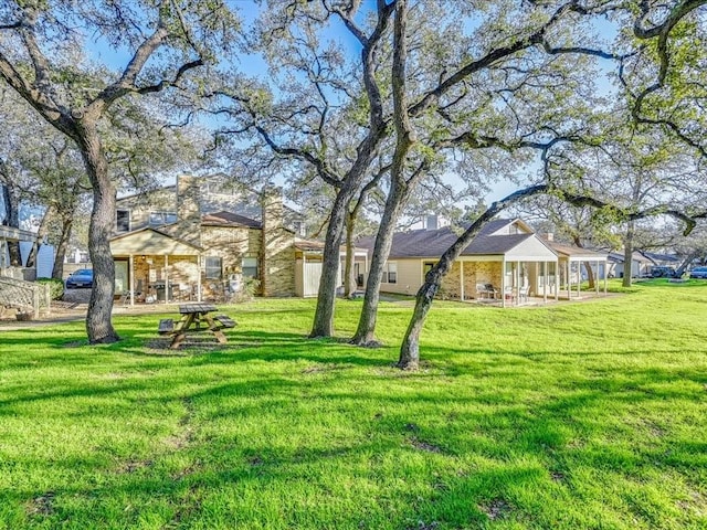 7825 Beauregard Cir Unit 5, Austin, TX 78745 - view of green lawn featuring a porch