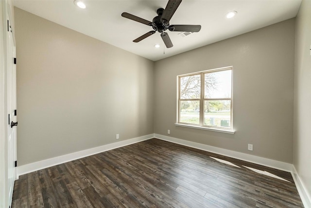 empty room featuring dark wood-type flooring and ceiling fan