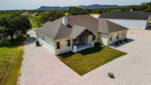 drone / aerial view featuring a mountain view