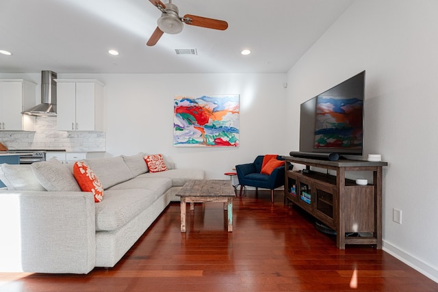 living room featuring dark hardwood / wood-style floors and ceiling fan