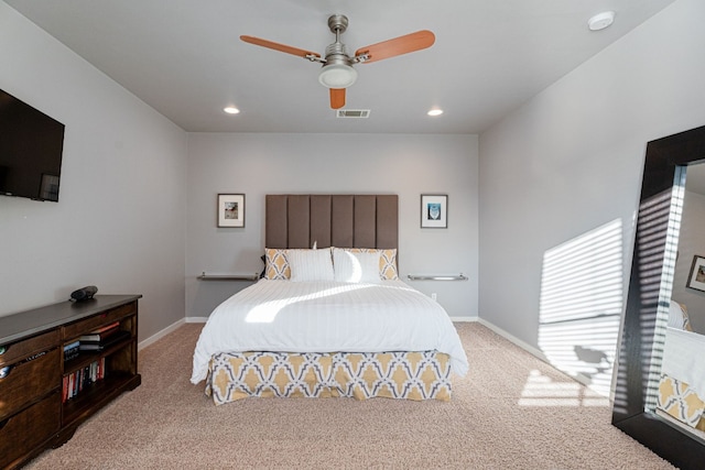 bedroom featuring light carpet and ceiling fan