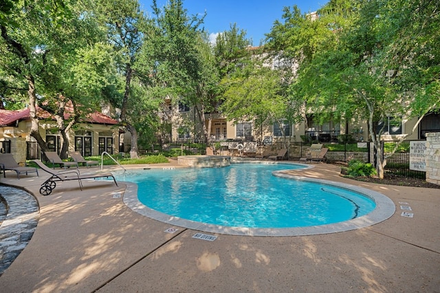 view of pool featuring a patio area