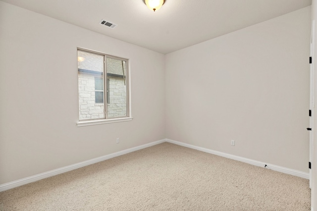 unfurnished room with carpet floors