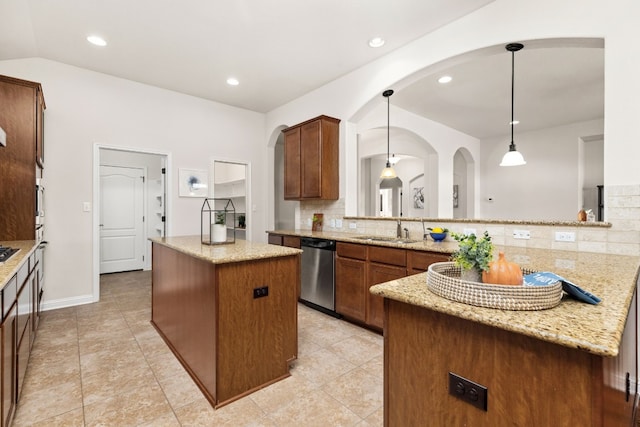 kitchen with light stone countertops, pendant lighting, dishwasher, tasteful backsplash, and a center island