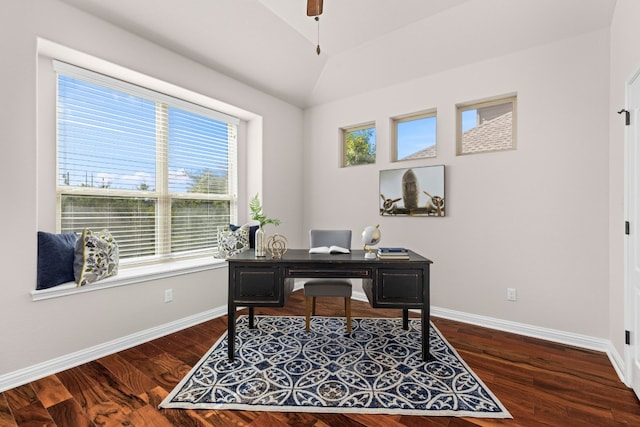 home office with lofted ceiling and dark wood-type flooring