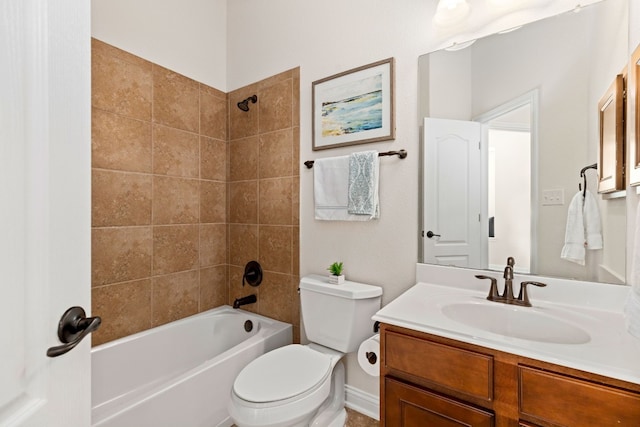 full bathroom featuring tiled shower / bath, toilet, and vanity