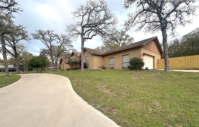 exterior space with a front lawn and a garage