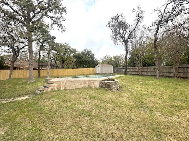 view of yard with a storage unit and a fenced in pool