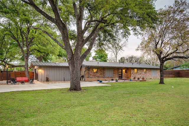 rear view of house with a lawn