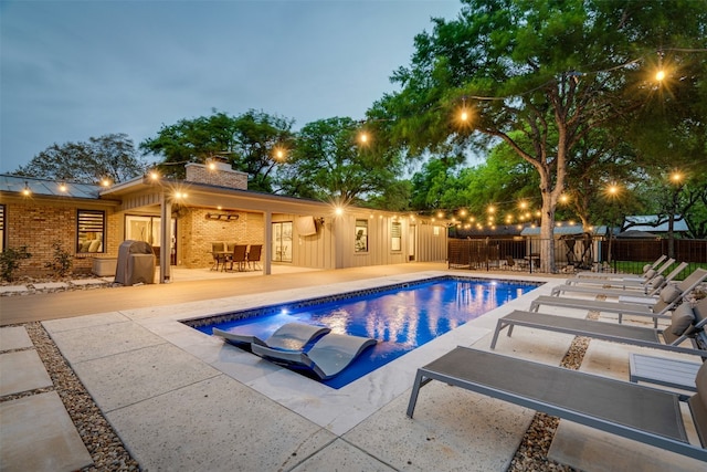 view of swimming pool with a patio area