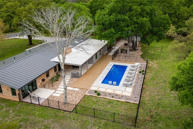 view of swimming pool with a lawn and a patio area