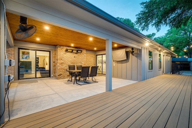 wooden terrace featuring a patio area