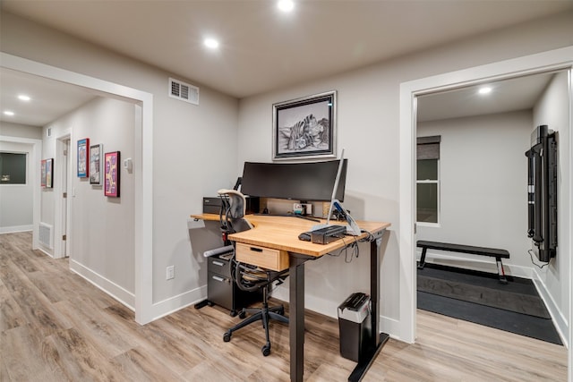 office area with light hardwood / wood-style floors