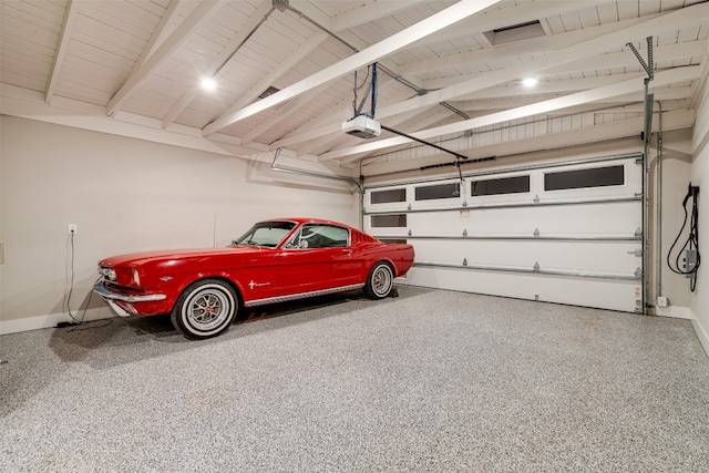 garage featuring a garage door opener and wood ceiling