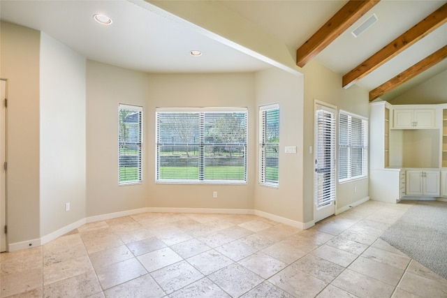 entryway with vaulted ceiling with beams and a wealth of natural light