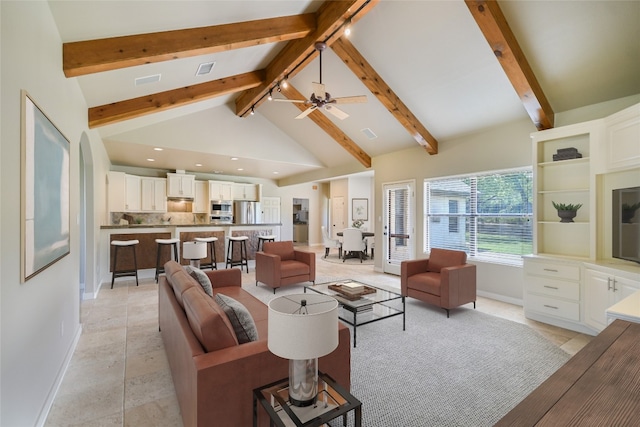 living room featuring beam ceiling, high vaulted ceiling, and ceiling fan