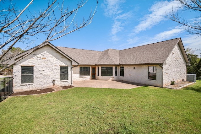 rear view of property featuring a patio, cooling unit, and a lawn