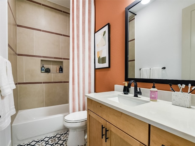 full bathroom with shower / bath combo, vanity, tile floors, and toilet