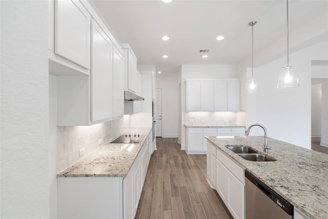 kitchen featuring visible vents, stainless steel dishwasher, a sink, light wood-type flooring, and black electric cooktop