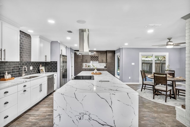 kitchen featuring dark hardwood / wood-style floors, tasteful backsplash, and island range hood