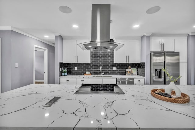 kitchen with backsplash, sink, stainless steel appliances, white cabinets, and island range hood