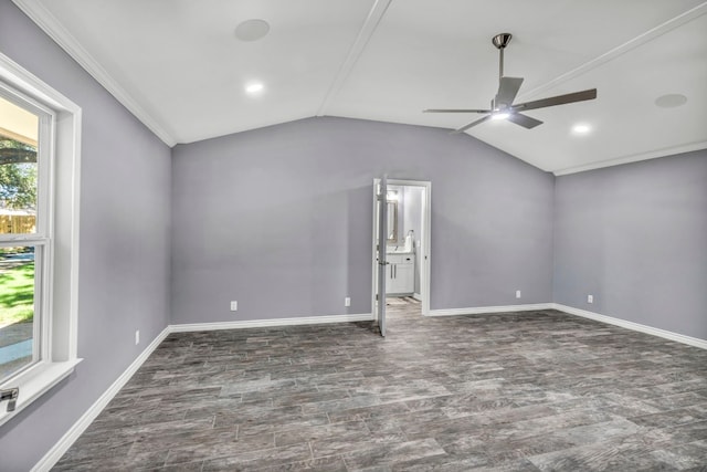 empty room with dark tile flooring, ceiling fan, and lofted ceiling