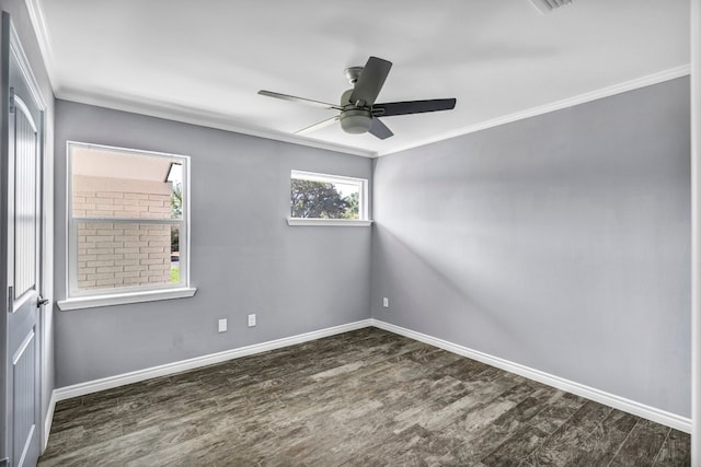 empty room with dark hardwood / wood-style flooring, ceiling fan, and crown molding