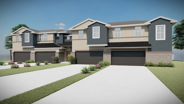 view of front of house featuring a front lawn and a garage