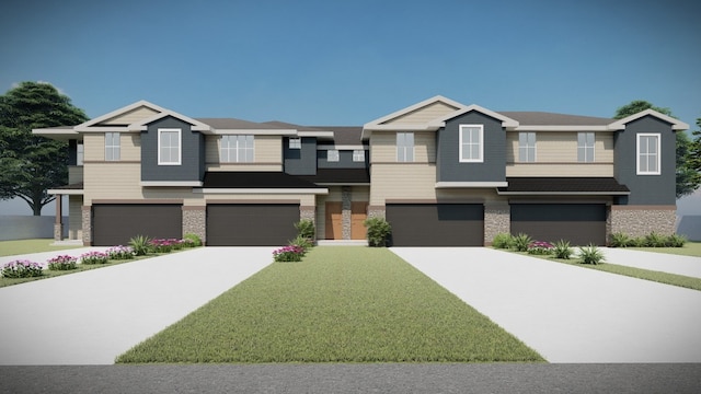 view of front of home with a front yard and a garage