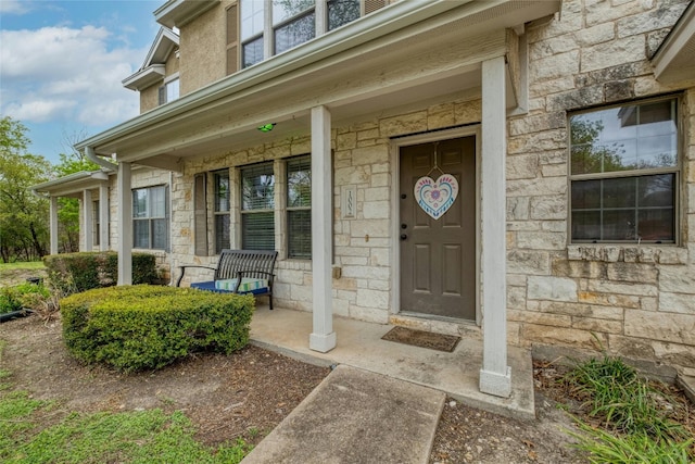 doorway to property with covered porch