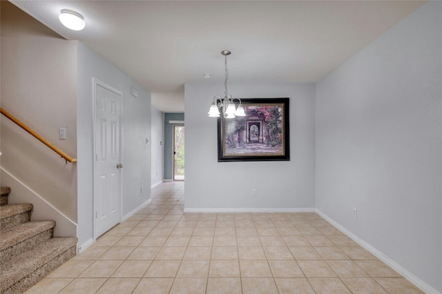 unfurnished dining area featuring a notable chandelier and light tile floors