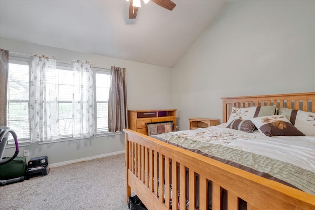 carpeted bedroom with vaulted ceiling and ceiling fan