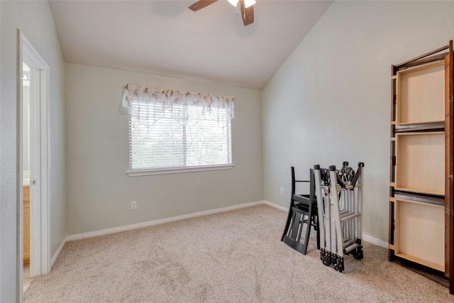 bedroom featuring vaulted ceiling, light carpet, and ceiling fan